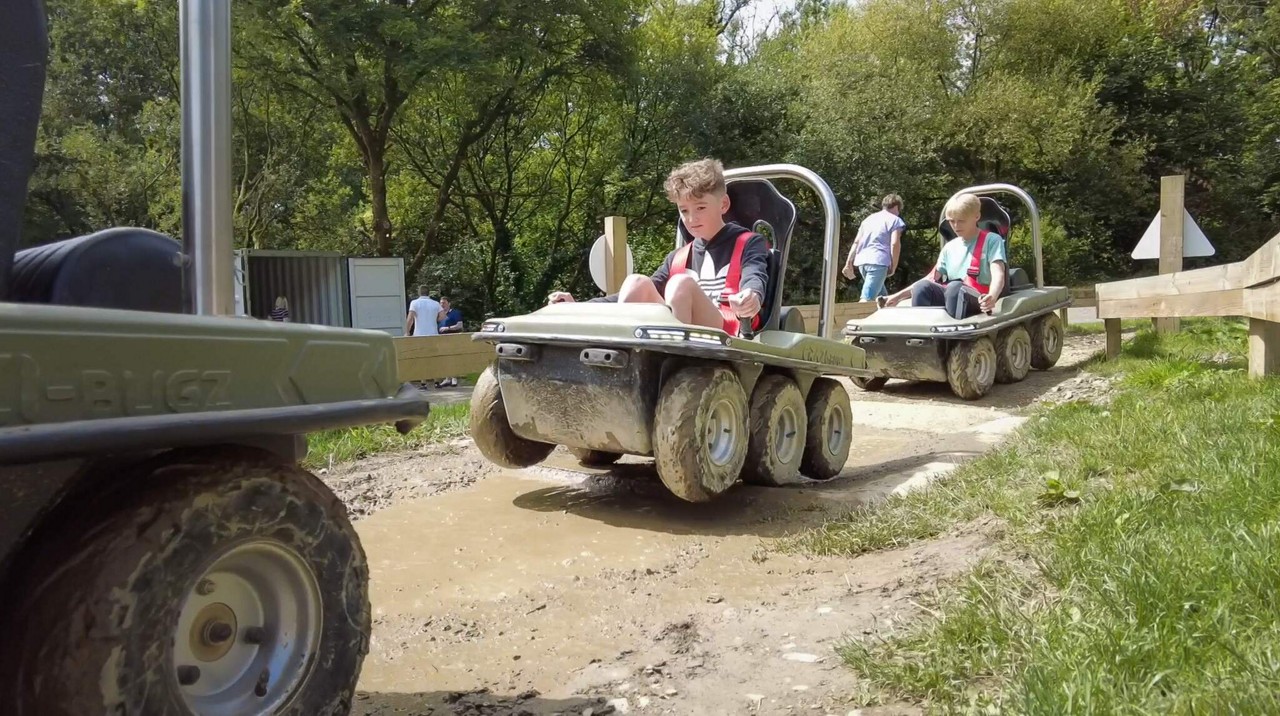 Young person ridding on an electric buggy.