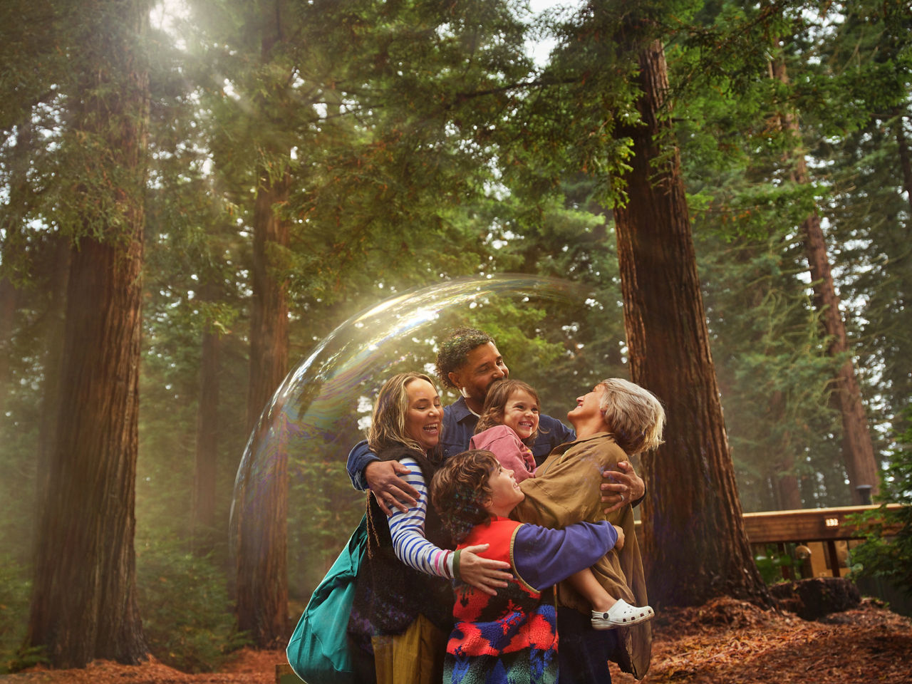 A family in a bubble on the pathway.