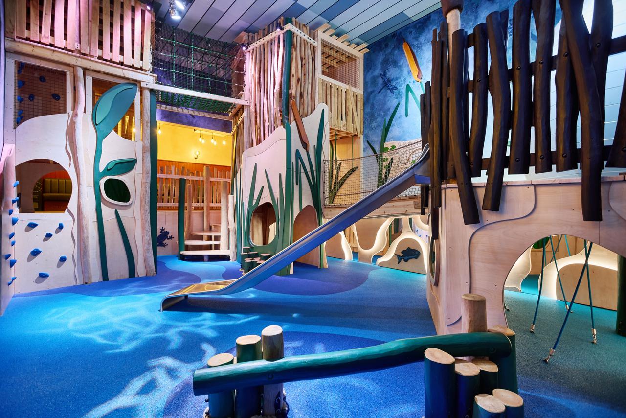 Two girls sliding down the Wild Water Rapids. 