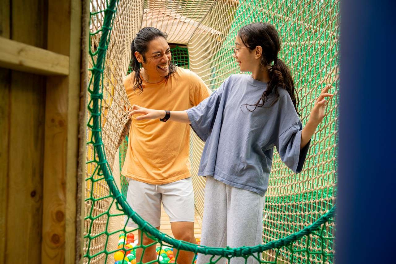 Two people exploring the Adventure Nets course.