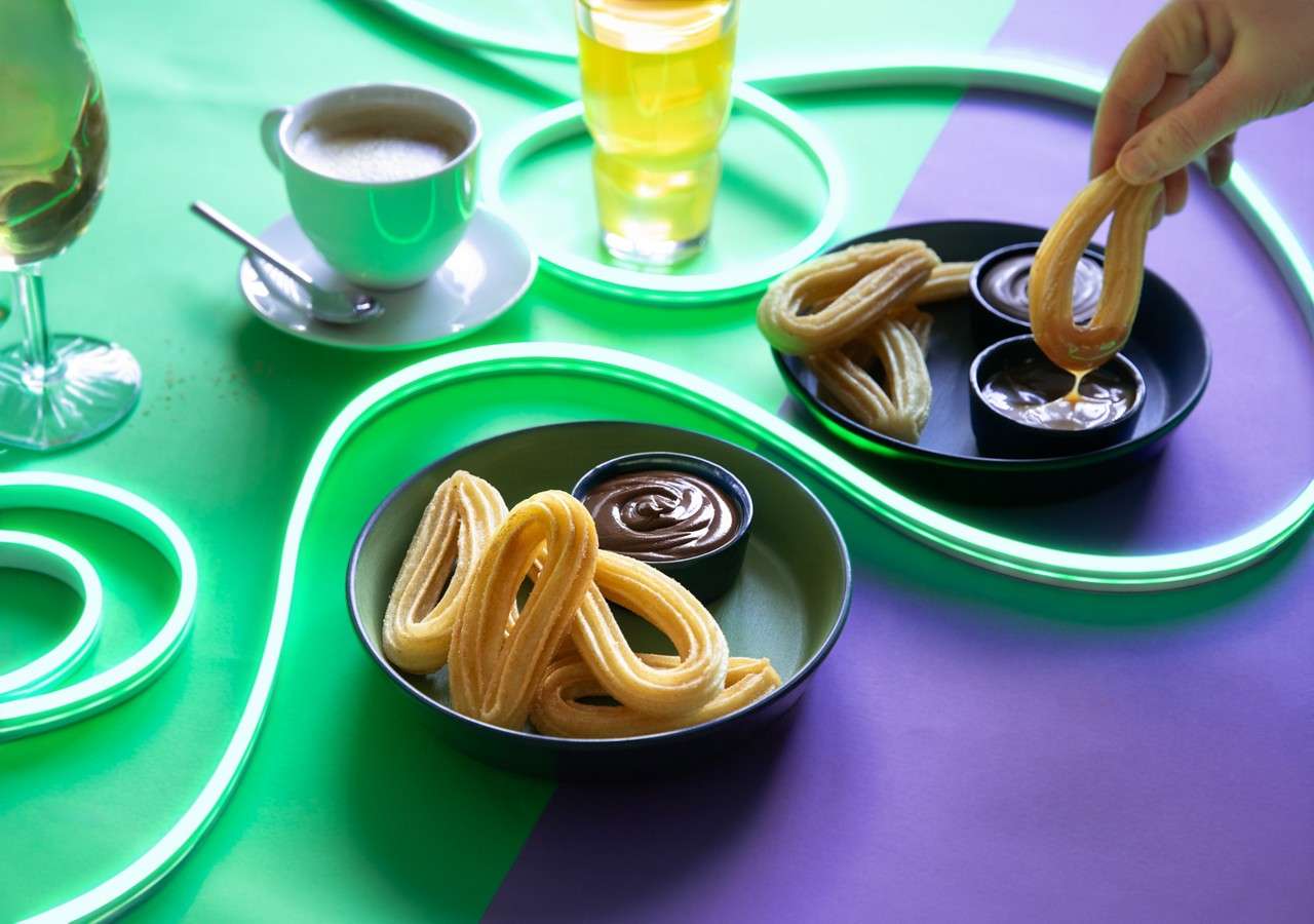 Churros with chocolate dipping sauce.