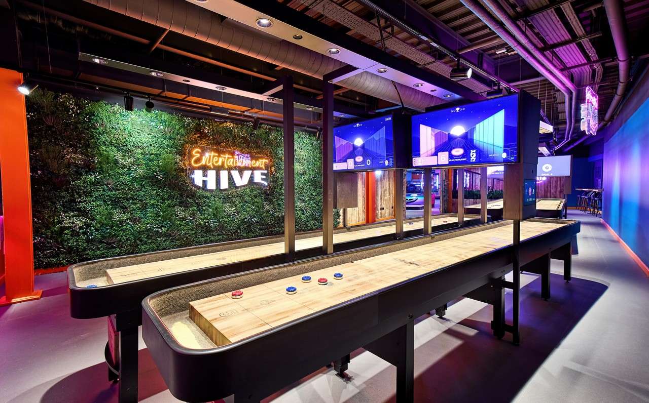 Shuffleboard pieces on a wooden table.