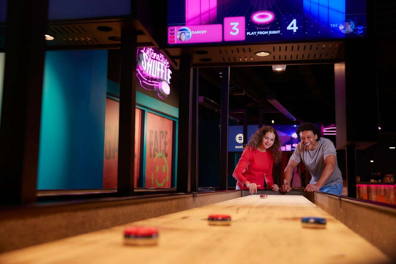 Two people playing Interactive Shuffle.