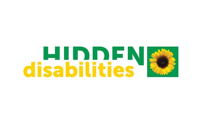 Logo displays bold green “HIDDEN” and yellow “disabilities,” accompanied by a sunflower icon in a green square, arranged horizontally on a white background.