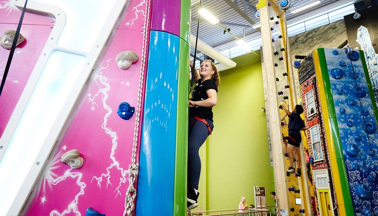 Girl on an indoor rock wall
