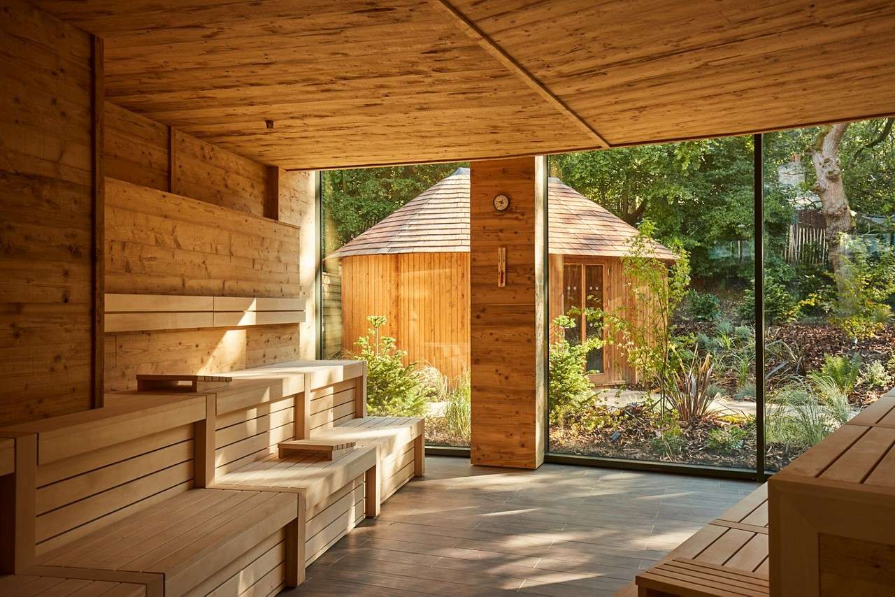 Inside the Nordic Sauna with views out to the surrounding forest.