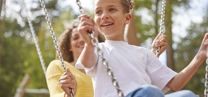 A mother and son on the play area