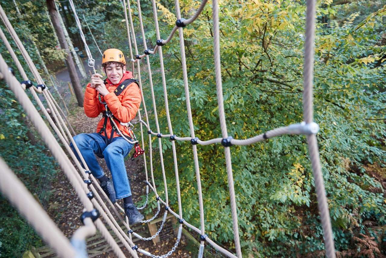 family completing aerial adventure