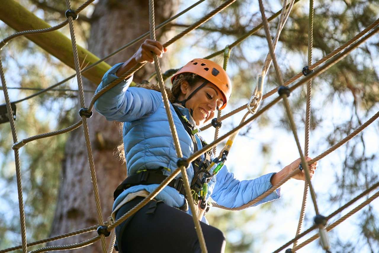 family completing aerial adventure