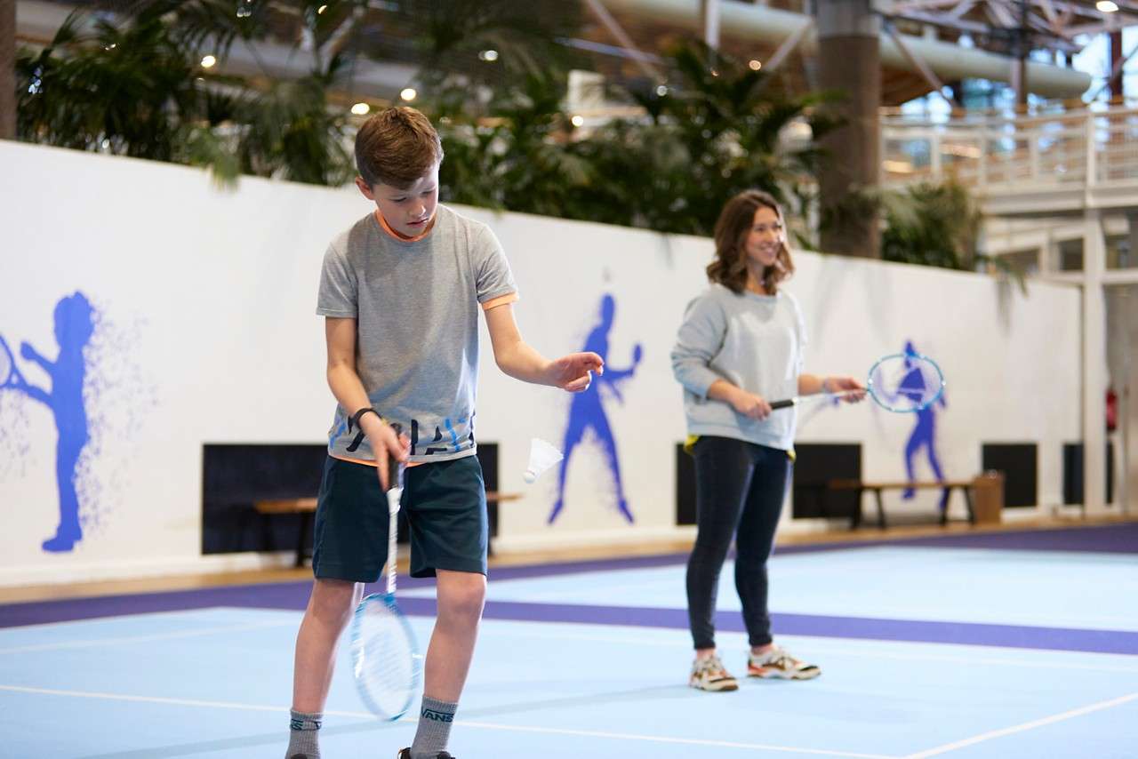 Young person playing badminton