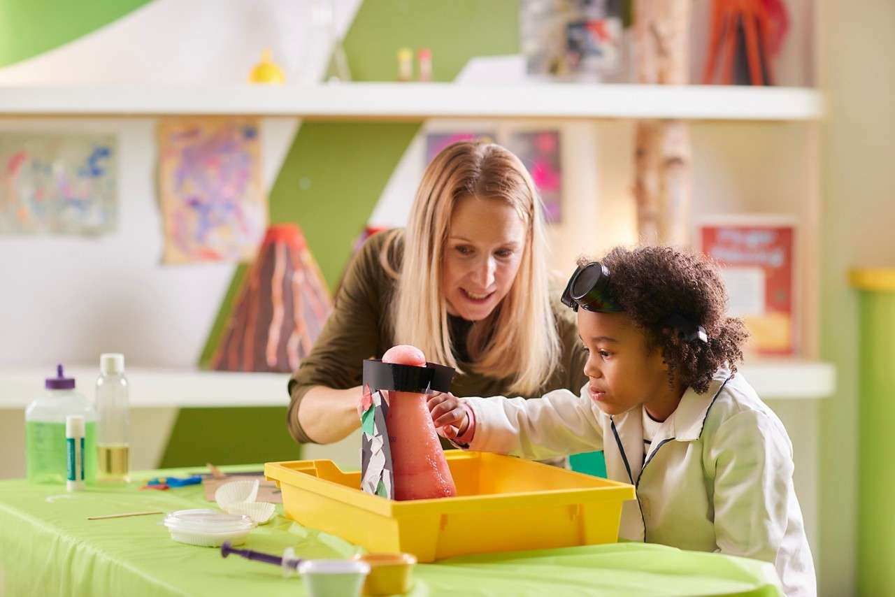 Young person doing some Crazy Science with an adult.