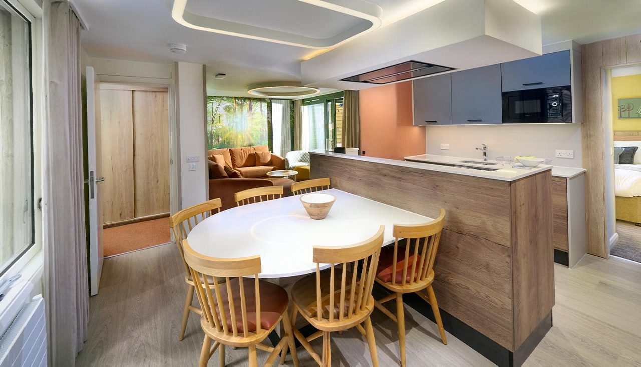 grand forest open plan kitchen, dining and living space.