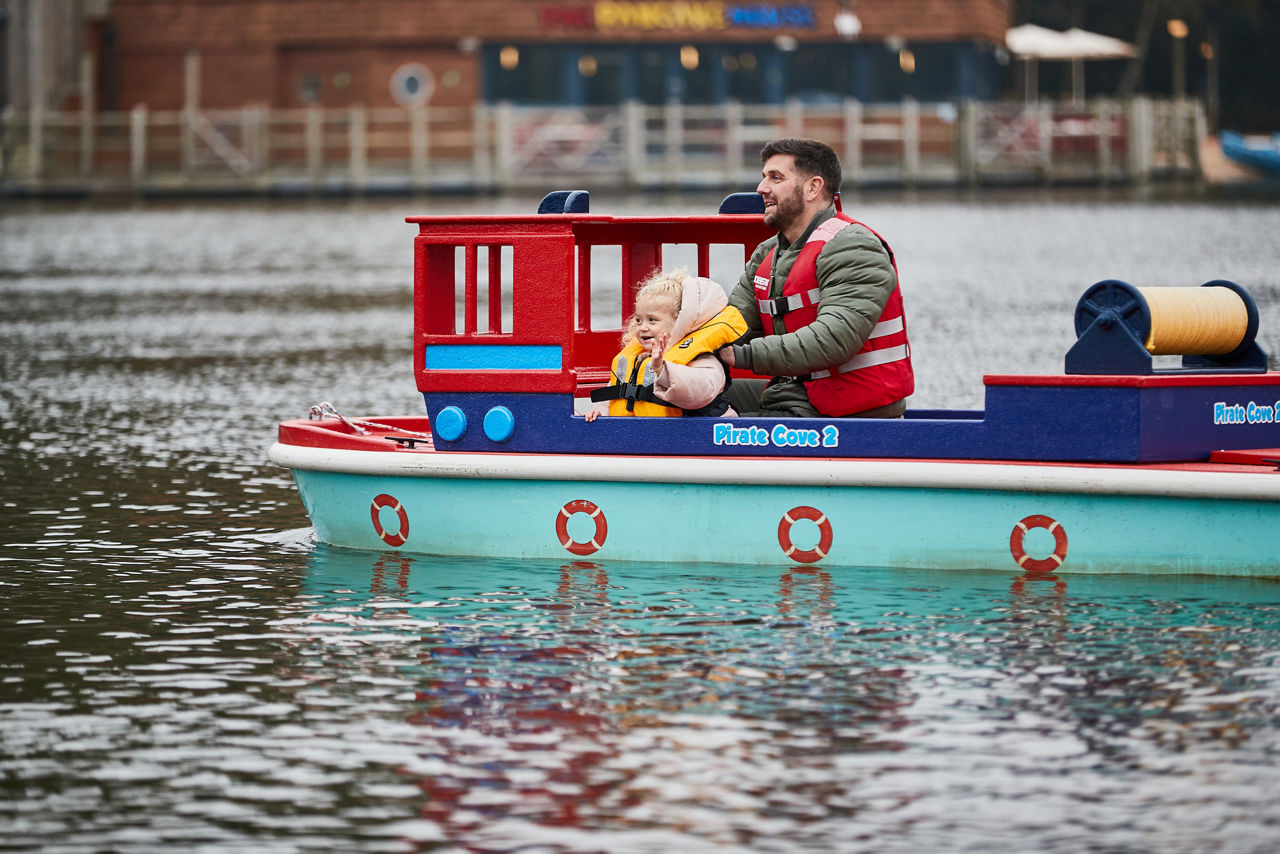 A family walking through the forest on a walkway.