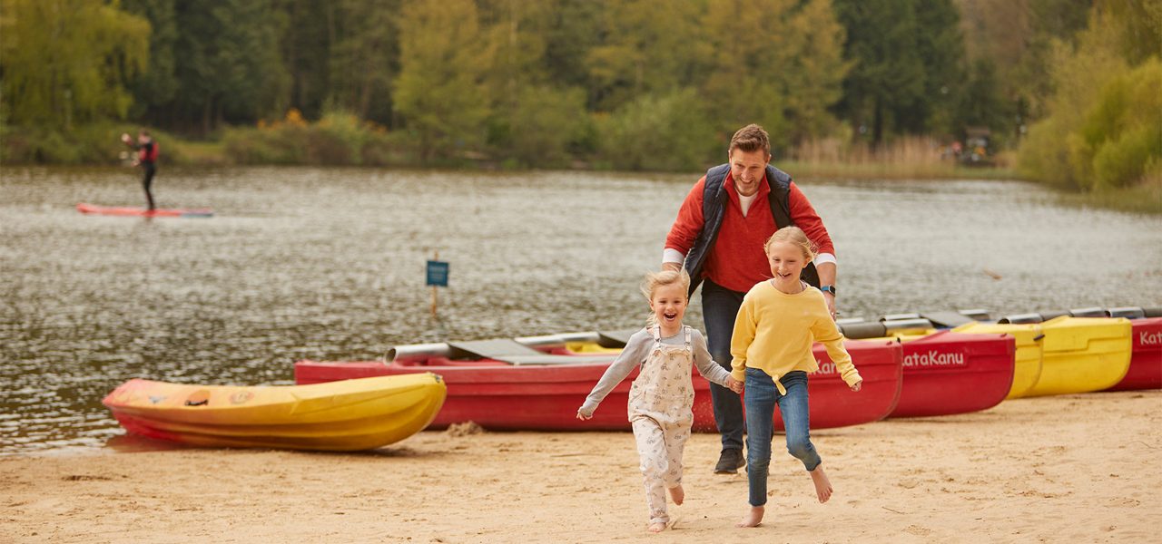A family running on the beach